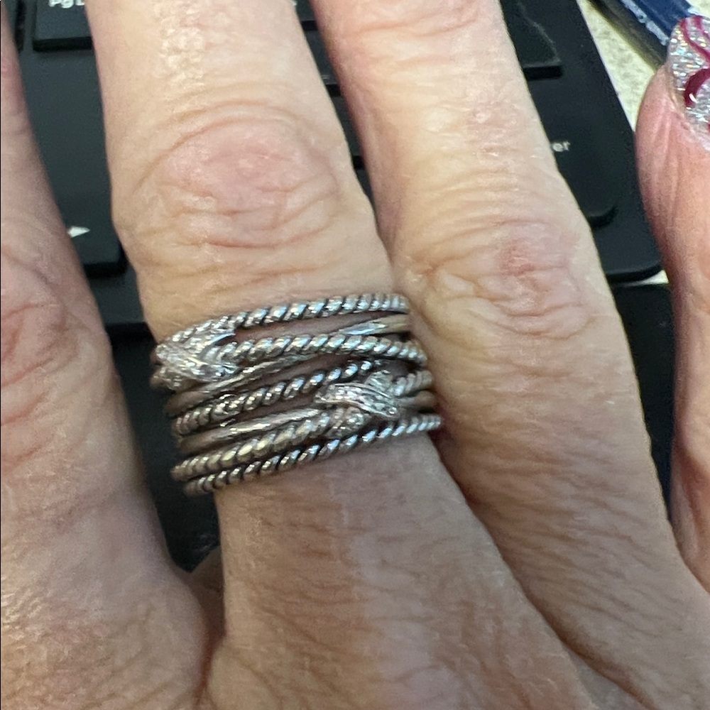 multilayered silver ring set Pave sparkles diamonds.